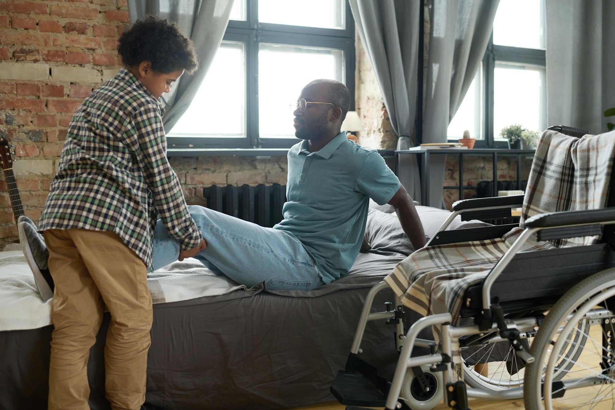 Son caring about his disabled father